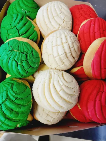 Green, white, and red conchas from La Mexicana Bakery
